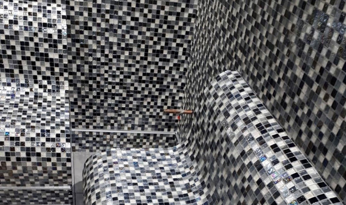 Award-winning tiler Sharon Taylor installs mosaics in steam room -  JACKOBOARD® S-kit benches benefit from her expertise